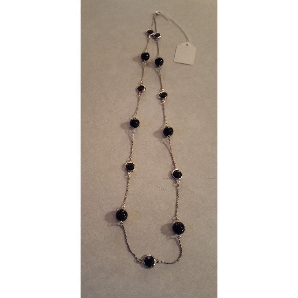 30 inch silver necklace with black beads very pretty... new